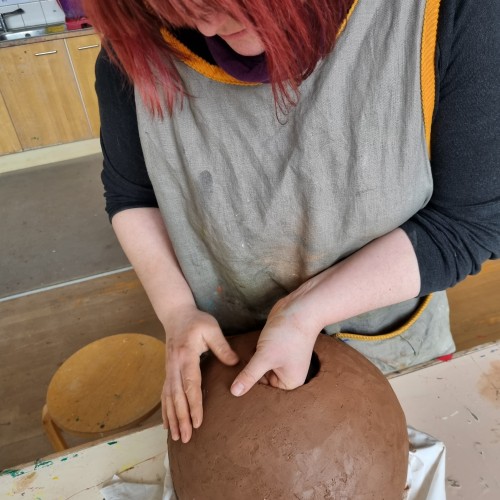 Ciara Gibson - Pockets of Experience exhibition, Artist in Residence 2022, Ciara Gibson working on large handmade pottery sphere